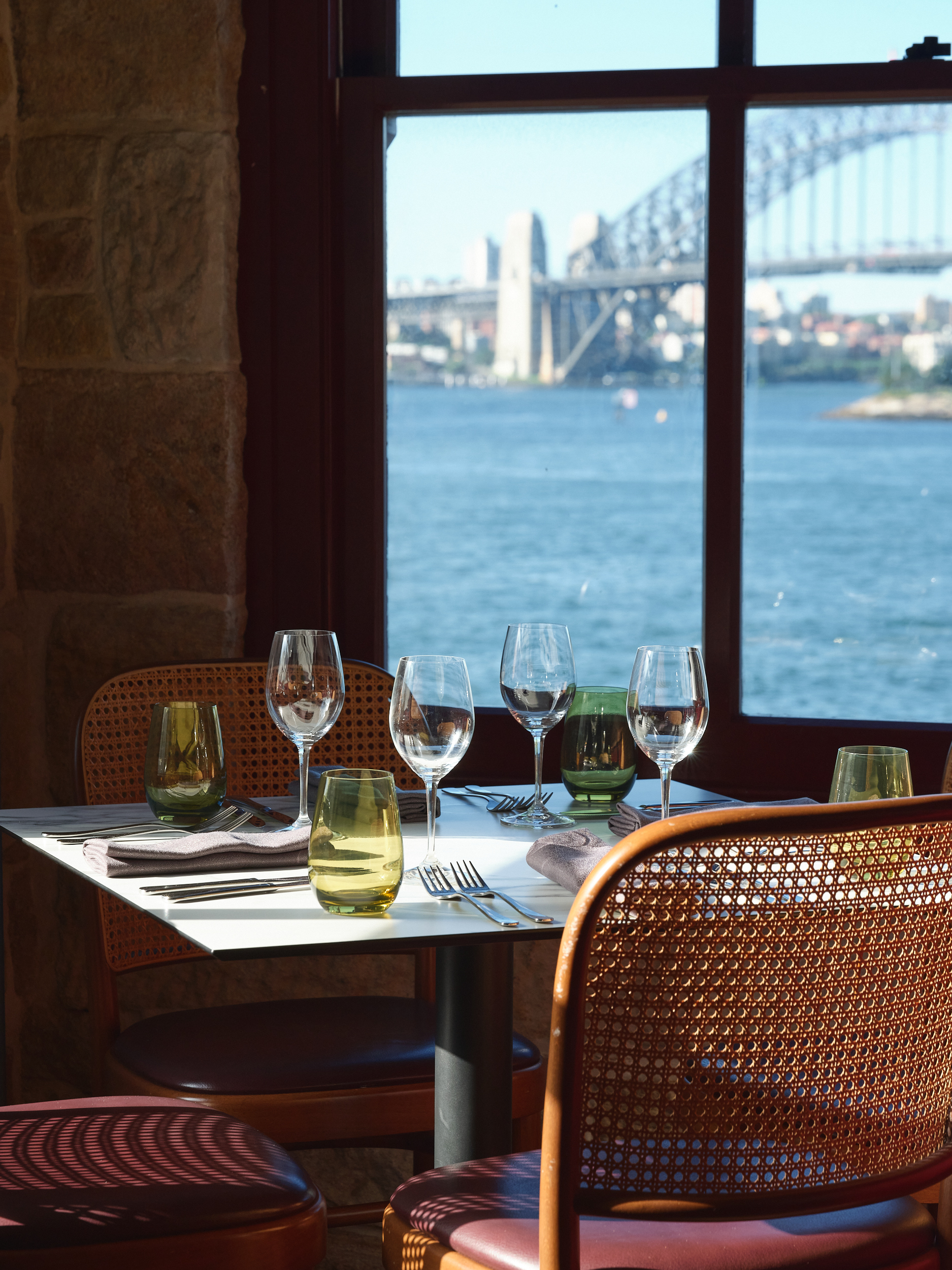 Window-side dining table with Sydney Harbour Bridge views