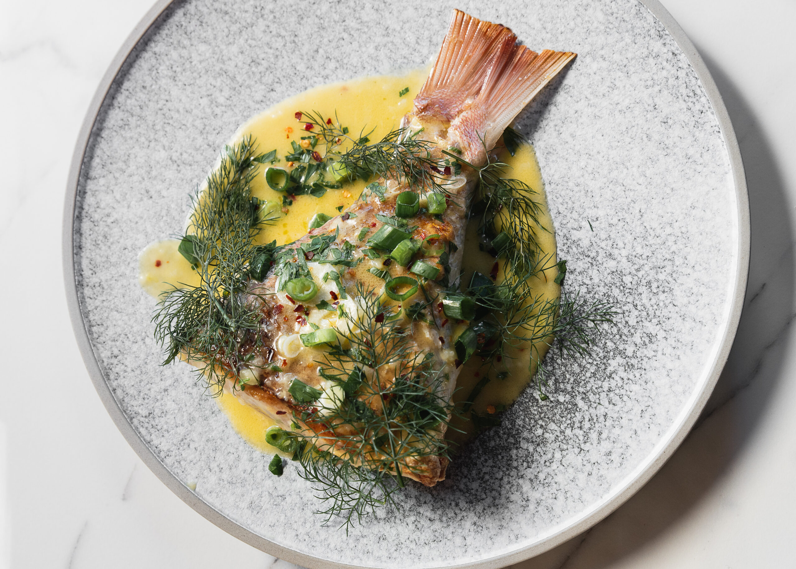 Plated seafood dish from The Fenwick menu